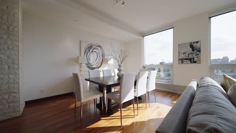 modern dining table next to a living room