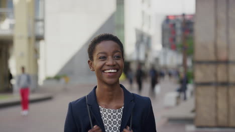 portrait happy african american business woman laughing enjoying professional urban lifestyle in city