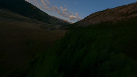 aerial view evening countryside dark village in mountain valley majestic sunset sunrise sky