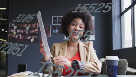 Animation-of-data-processing-over-african-american-businesswoman-in-office