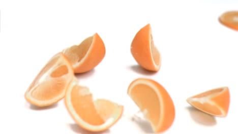 Orange-falling-into-pieces-in-super-slow-motion