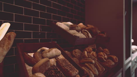 variety of fresh breads in a bakery display