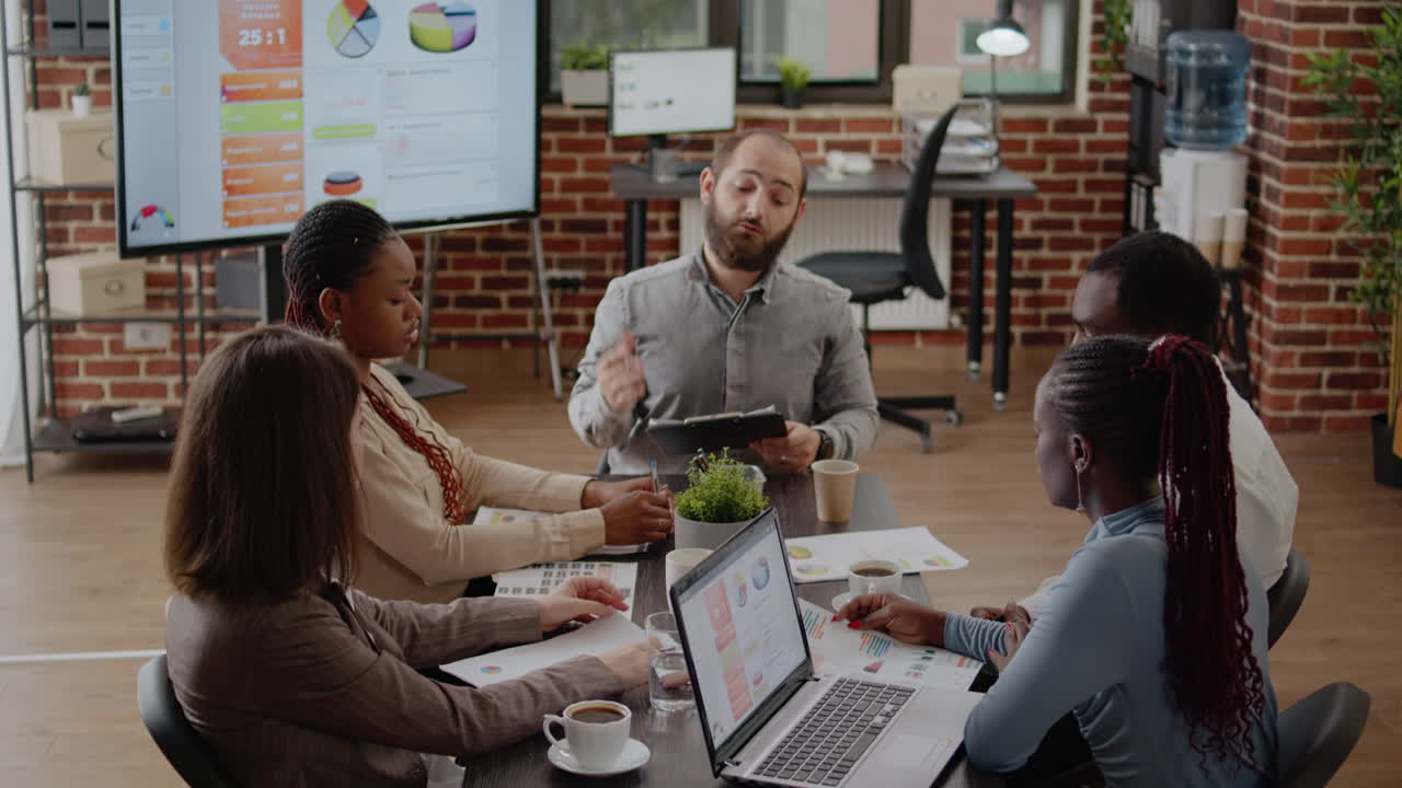 Team of colleagues meeting to plan business strategy