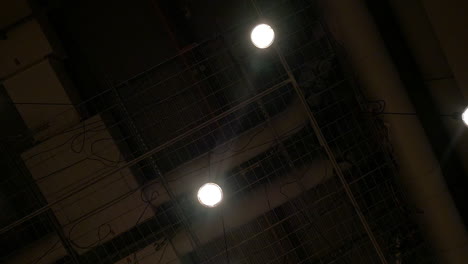 view to the dark ceiling with hanging lamps