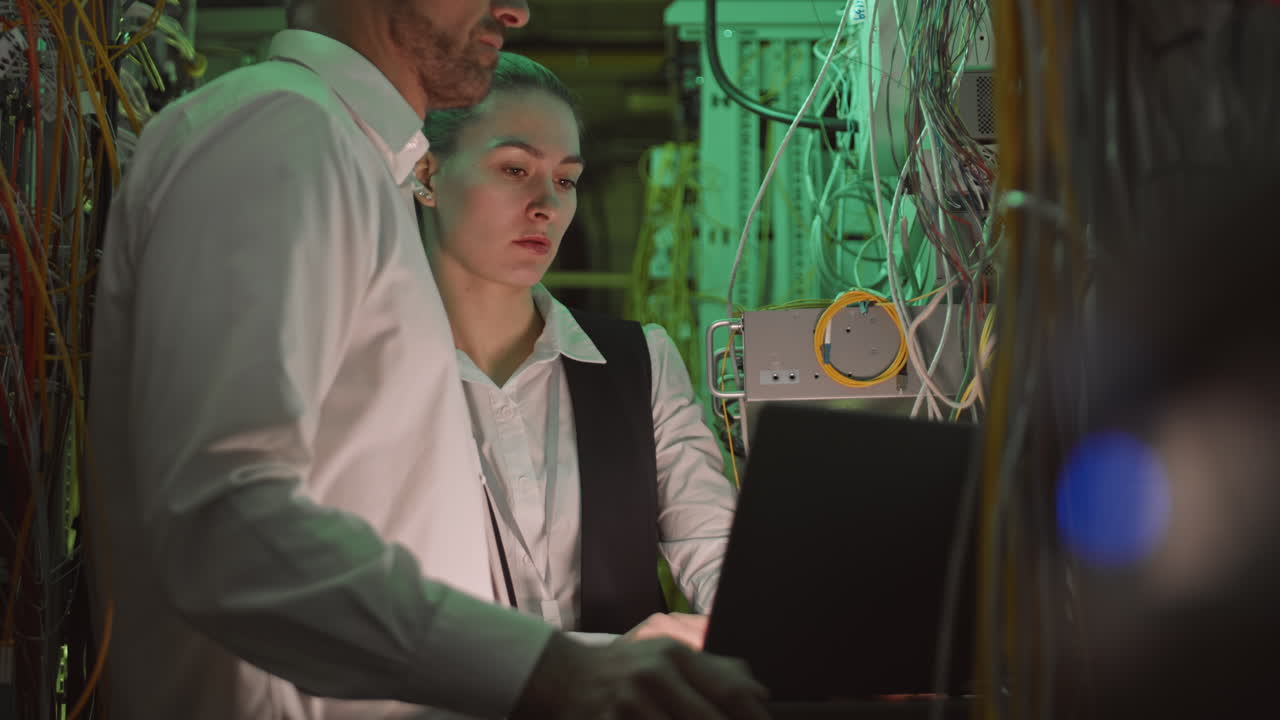 IT Technicians Working in a Server Room