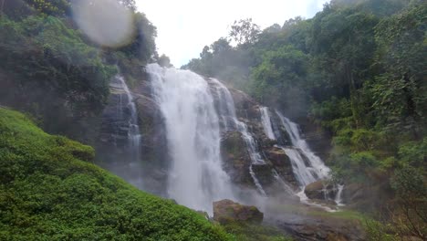 dynamic view of stunning waterfall in lush jungle with water hitting lens