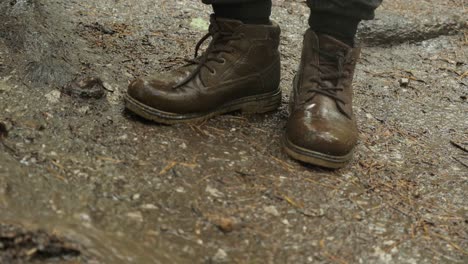 muddy boots in the forest