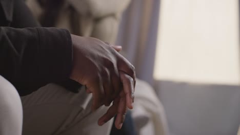 Close-Up-On-Hands-As-Couple-At-Home-Sitting-On-Sofa-In-Lounge-Having-Break-Up-Argument