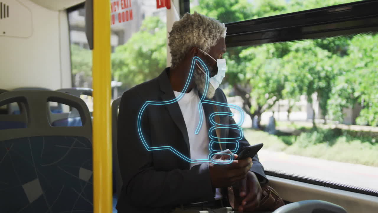 Man wearing mask holding phone on bus with thumbs-up animation overlay
