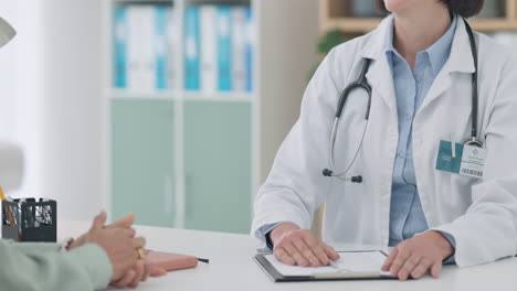 Closeup,-doctor-and-handshake-of-patient-to