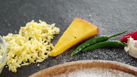 Flour-on-plate-with-spices-and-vegetables-on-table