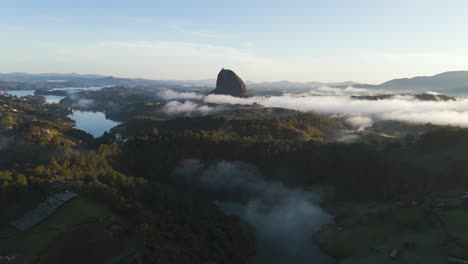 El-Penon-de-Guatape-Landmark-in-Colombia,-Aerial-Drone-Landscape-at-Sunset