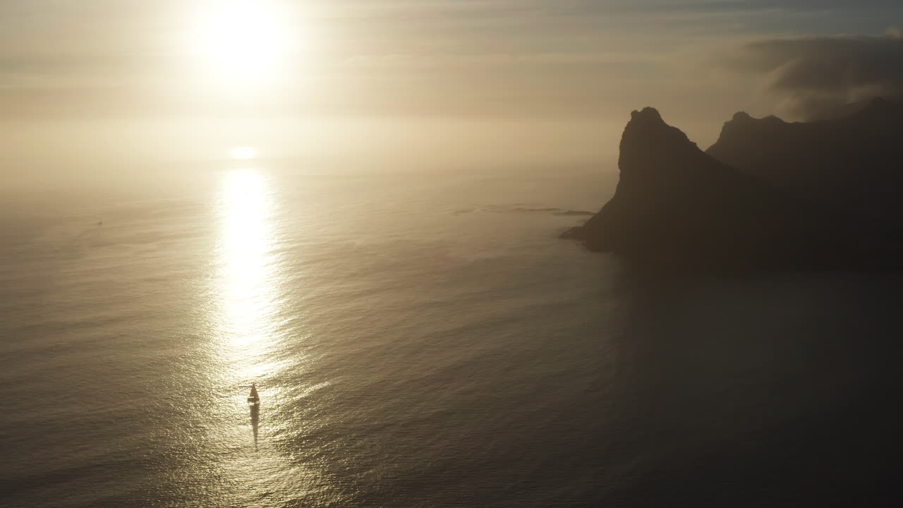 Yacht Sails on Sea at Sunset