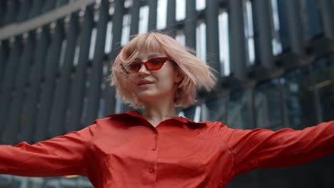 stylish woman dancing in the city