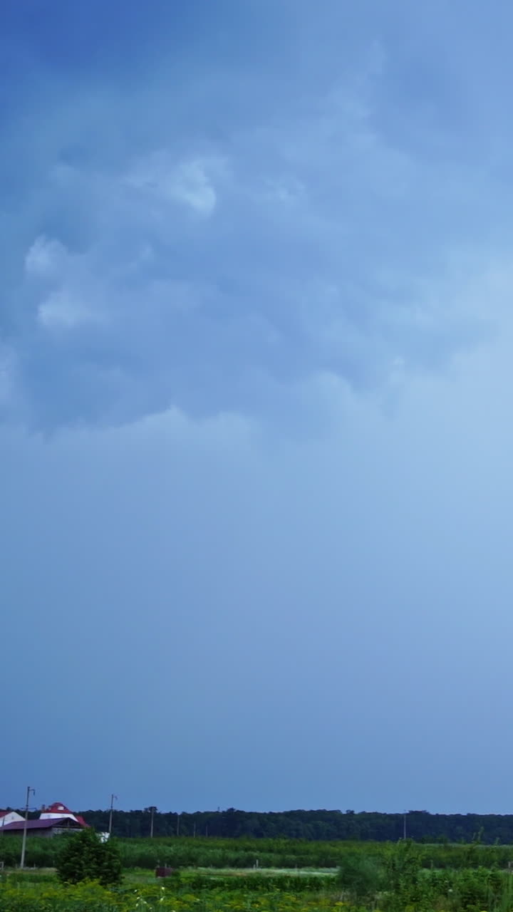 Bright lightning on the sky. Realistic view of direct lightning from sky to the ground in rural place. Dangerous time. Vertical video