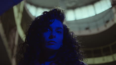 woman bathed in blue light