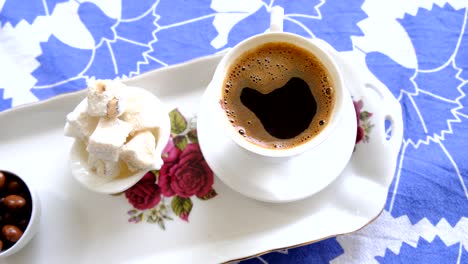 turkish delight and coffee served on the table