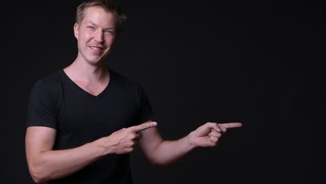 happy man showing copy space with hands