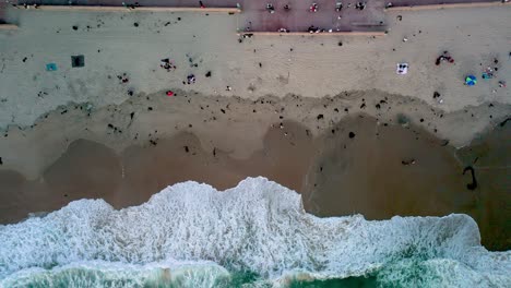 Above-View-Of-Foamy-Waves-At-Mission-Beach-In-San-Diego,-California-USA