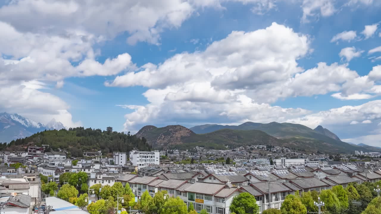 Panoramic City View with Mountains and Clouds
