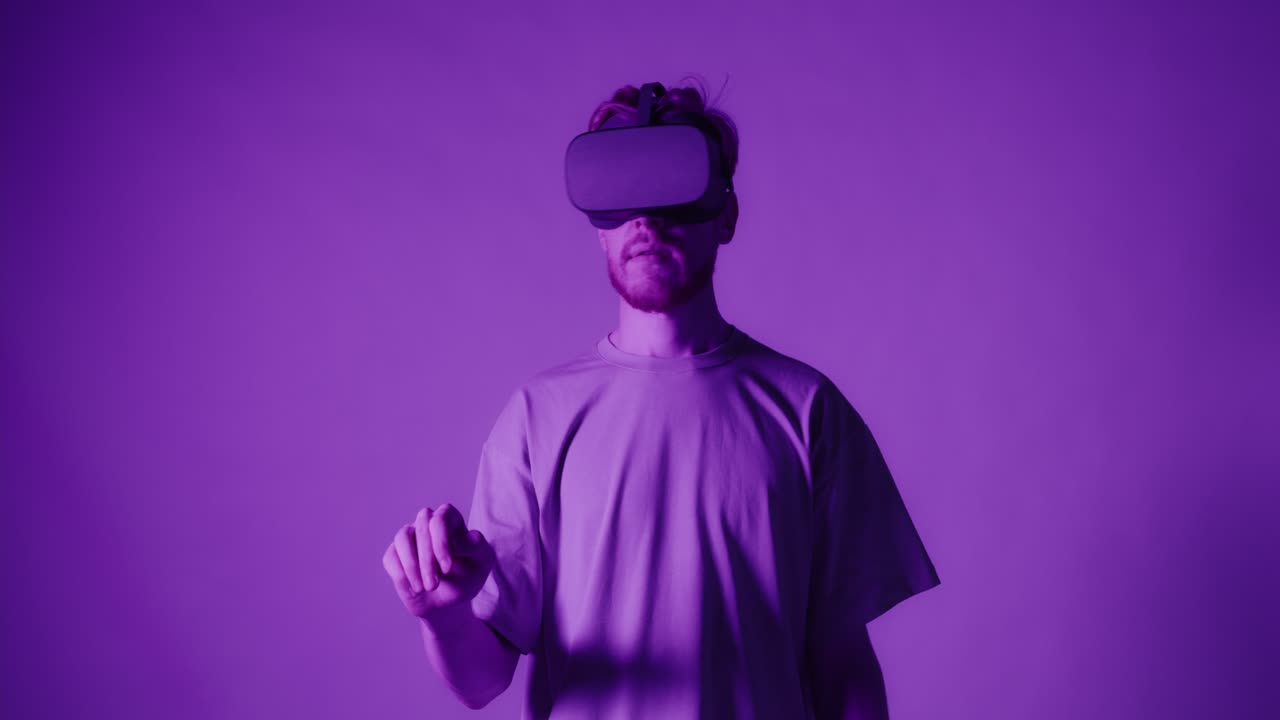 Man Wearing VR Headset in Purple Light