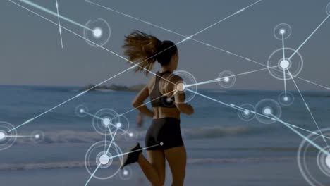 Animation-of-networks-of-connections-over-caucasian-woman-running-on-beach