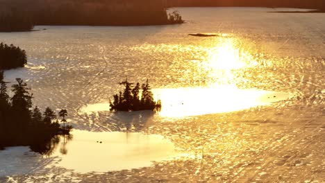 golden hour sunlight shines over lake hebron melting ice