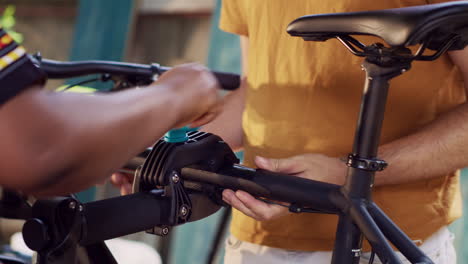 multiethnic couple adjusting bicycle