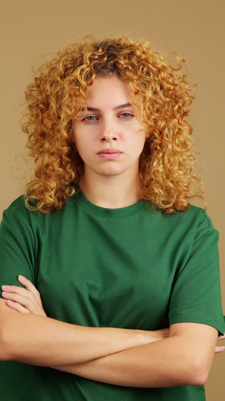 Young Woman with Curly Red Hair and Green Shirt