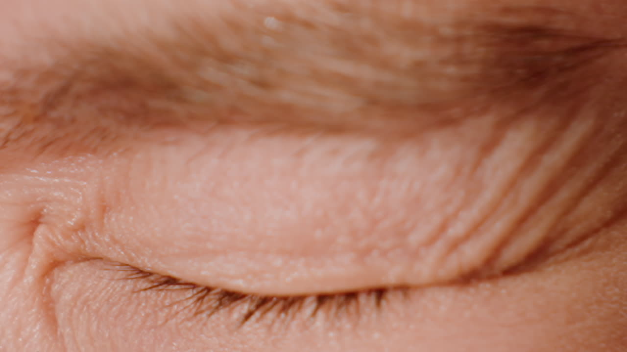 Eyes Briefly Closed During Calming Practice, Relaxing Exercise Involving Slow Eyelid Closure And Gentle Blinking, Caucasian Adult Softly Blinks Their Eyes Closed In Peaceful Relaxation Session