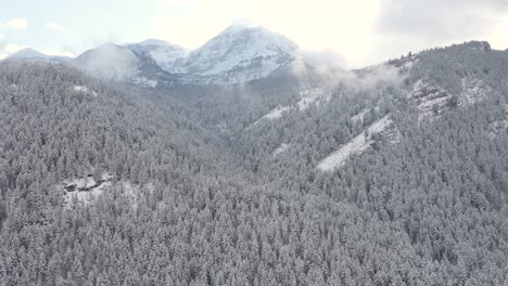 drone shot of the wasatch mountains covered in snow during the winter
