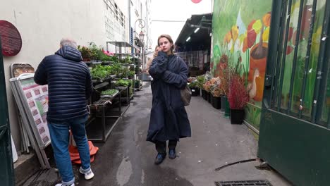 people walking through a vibrant flower market