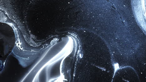 abstract macro view of alcoholic ink blending with sparkles in deep, swirling colors