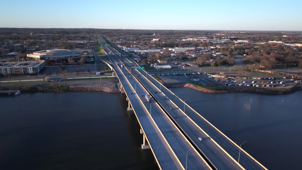 Stunning Aerial View of Highway 30 bridge, Arkansas River in Downtown Little Rock over traffic of cars