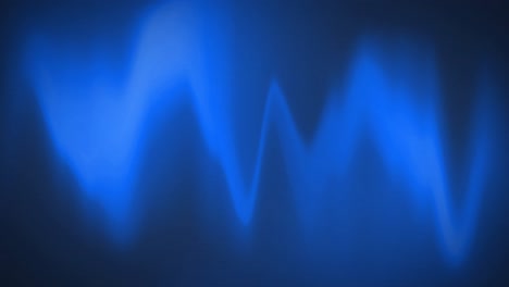 digital animation of blue heart rate monitor waves on black background