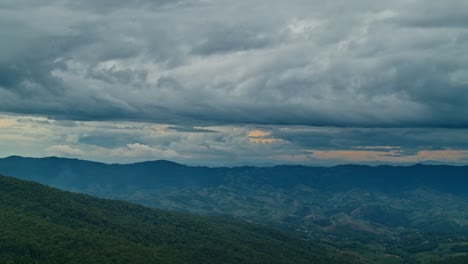 mountainous landscape under dramatic cloudscape