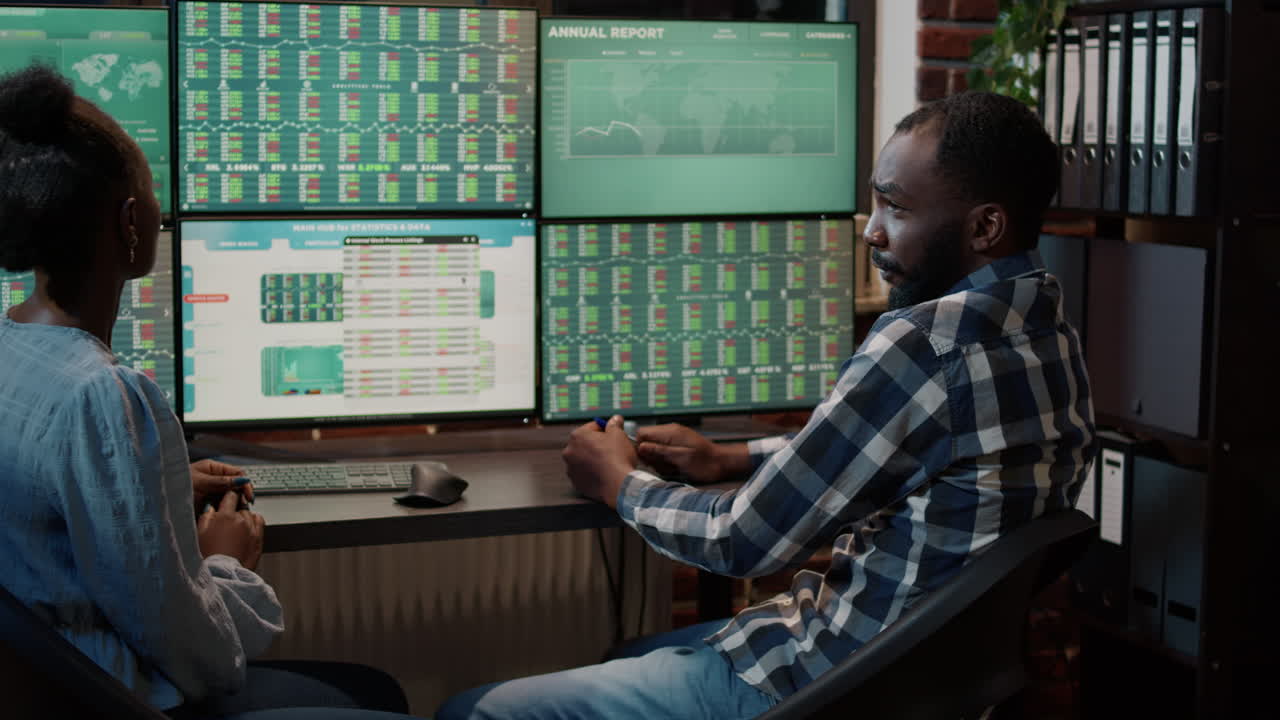 Financial investment team monitoring exchange market charts