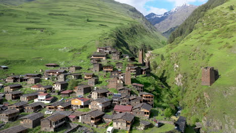 descending drone shot of dartlo village in tusheti georgia with medieval combat towers