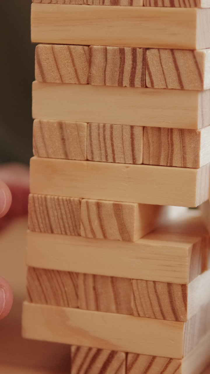 Couple Playing Jenga Game At Home
