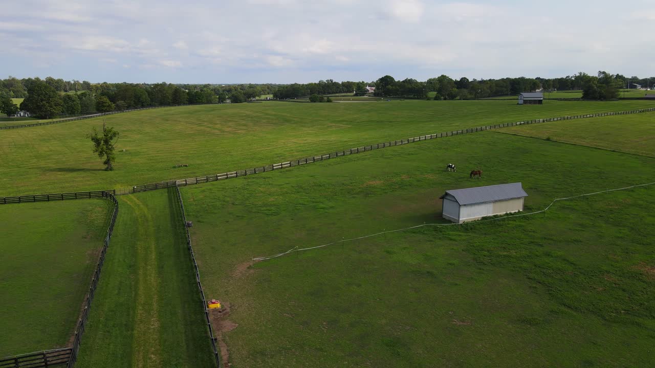 Landscape with fenced fields, barns in Kentucky Horse Park, Lexington, Kentucky, USA
