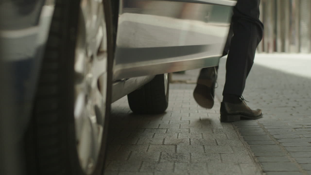 People getting out of a car on a city street
