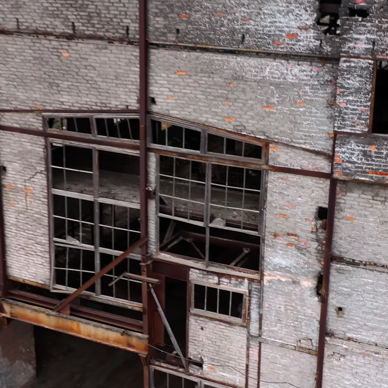 Abandoned building during war time. Destroyed building with broken windows. Exterior of ruined architecture.