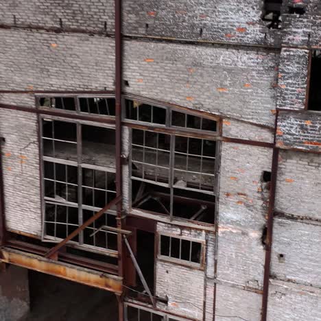 abandoned building during war time. destroyed building with broken windows. exterior of ruined architecture.