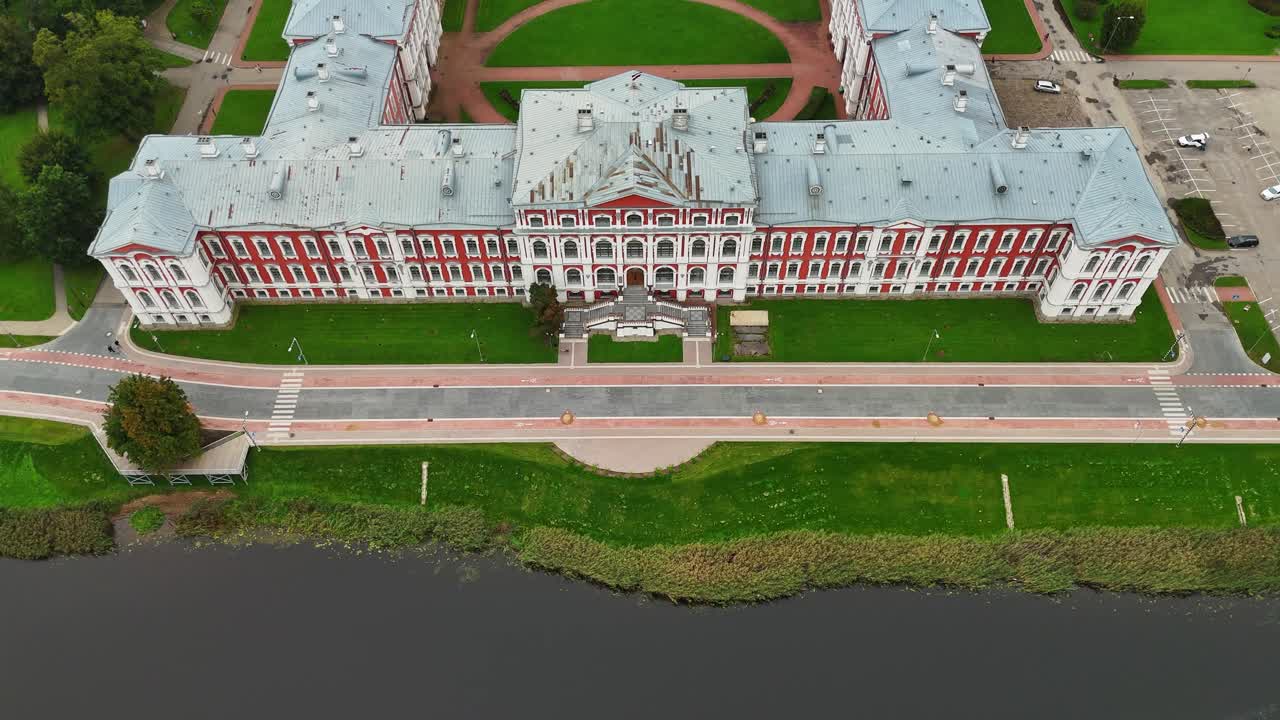 Jelgava Palace On The Banks Of Lielupe River In Jelgava, Latvia. - aerial shot