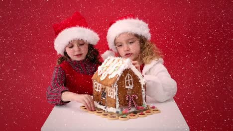 Composición-De-Video-Con-Nieve-Cayendo-Sobre-El-Escritorio-Con-Niños-Mirando-La-Casa-De-Jengibre