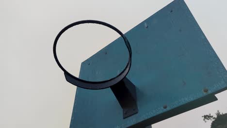 basketball hoop ring and backboard on a wet raining weather day