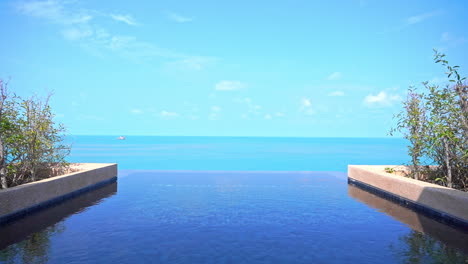 high-rise rooftop infinity pool with amazing view on turquoise seascape