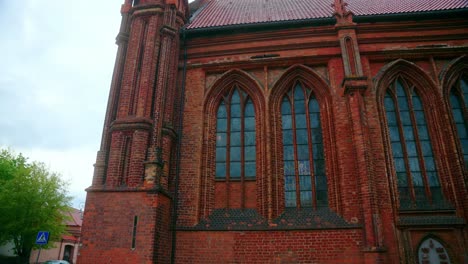 brick and gothic facade of the church of st