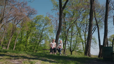 two senior women relaxing in a park