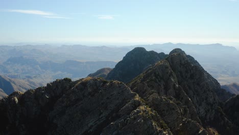 drone shot of two hikers on top of the four peak, in mazatzal mountains, arizona, usa